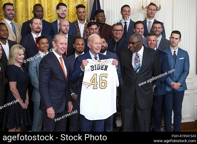 United States President Joe Biden, center, is joined by Houston Astros Owner Jim Crane, left, and Houston Astros Manager Dusty Baker, right