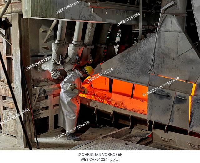 Industry, Worker controlling smelting process
