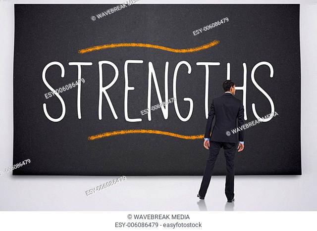 Businessman reading the word strengths