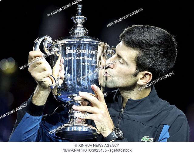 (180910) -- NEW YORK, Sept. 10, 2018 (Xinhua) -- Novak Djokovic of Serbia celebrates with his trophy during the awarding ceremony for the men's singles at the...