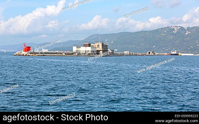 Trieste, Italy - October 14, 2014: Restaurant and Lighthouse at Breakwater Molo Foraneo Port in Trieste, Italy