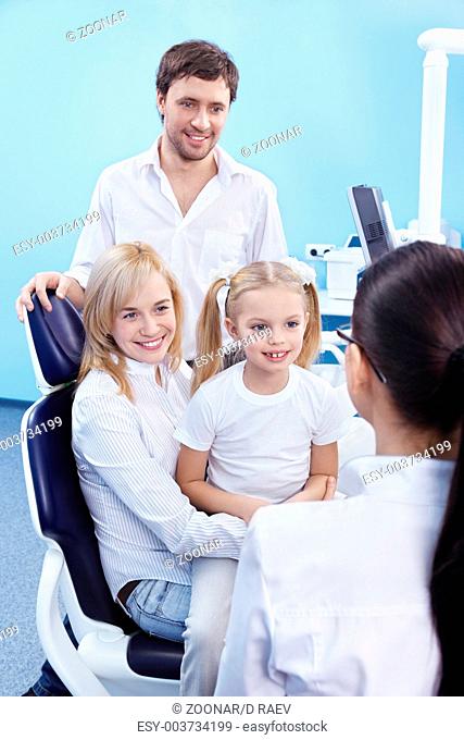 Young family with a child in the dental office