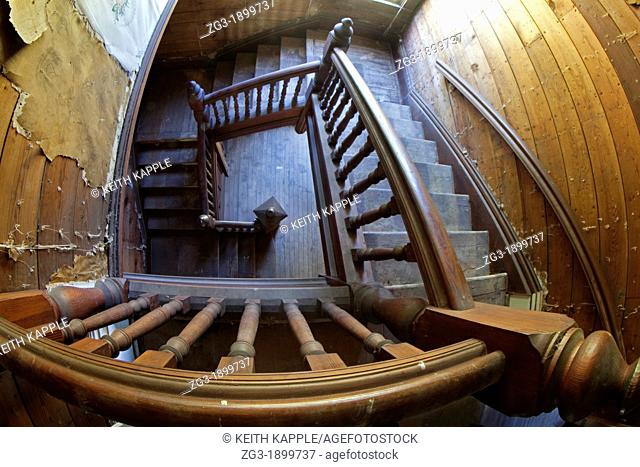 Interior of an old staircase in an abandoned Victorian era home, 1887, Calvert, Texas
