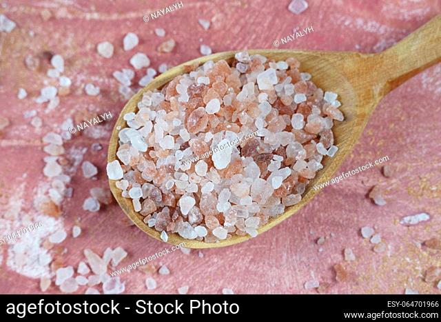 Himalayan pink salt crystals on spoon