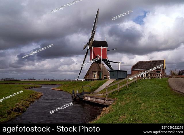 Heavy clouds above the Hoogmadese windmill near the Dutch village Hoogmade