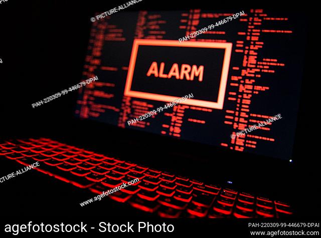 FILED - 19 November 2016, Stuttgart: ILLUSTRATION - A computer illuminated in red displays a fictitious error message (posed scene)