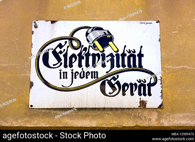 Germany, Baden-Württemberg, Kraichtal-Gochsheim, old historical enamel sign, text: electricity in every device