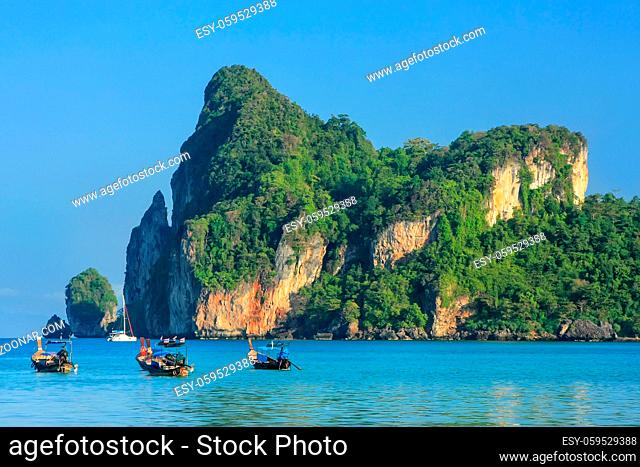 Ao Loh Dalum bay with anchored longtail boats on Phi Phi Don Island, Krabi Province, Thailand. Koh Phi Phi Don is part of a marine national park