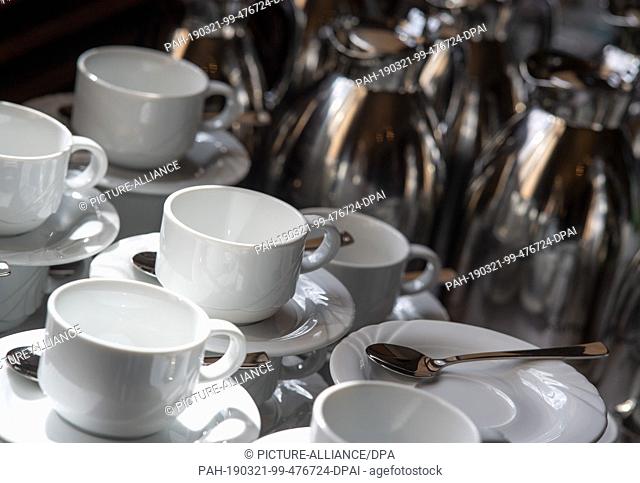 18 March 2019, Berlin: Empty porcelain cups and coffee pots standing on a table at the Federal Ministry of Economics and Labour Photo: Monika...