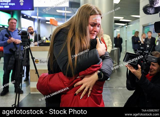 RUSSIA, MOSCOW - DECEMBER 19, 2023: Alexandra Zhulina hugs her son who has arrived on an Istanbul-Moscow flight, at Vnukovo International Airport