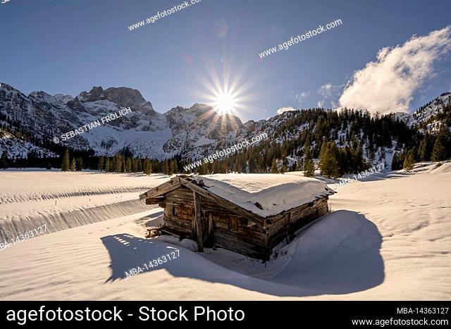 A small old wooden hut in the Rhone Valley, near Hinterriss in the Karwendel, a part of the Alps in Austria in winter with snow