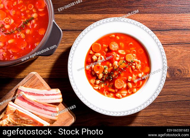 Delicious minestrone soup in plate, top view. Traditional italian cuisine