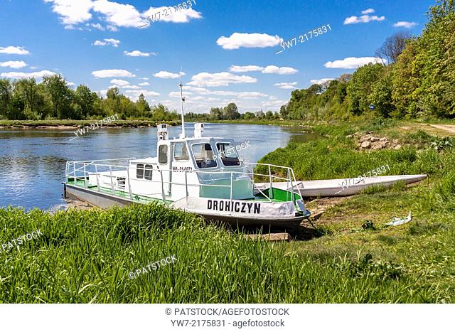 Drohiczyn boat moored on Bug river in Drohiczyn, Poland