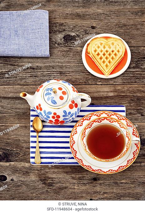 A heart shaped waffle and tea