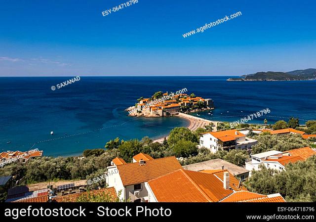 Aerial view of Sveti Stefan, Budva, Montenegro from drone. Panoramic above view of Saint Stephen luxury resort. Tourism and leisure concept