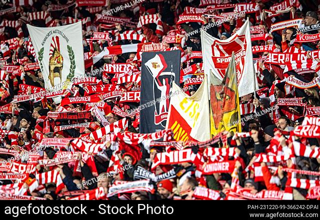 20 December 2023, Berlin: Soccer: Bundesliga, 1. FC Union Berlin - 1. FC Köln, Matchday 16, An der Alten Försterei. Union Berlin fans cheer on their team with...