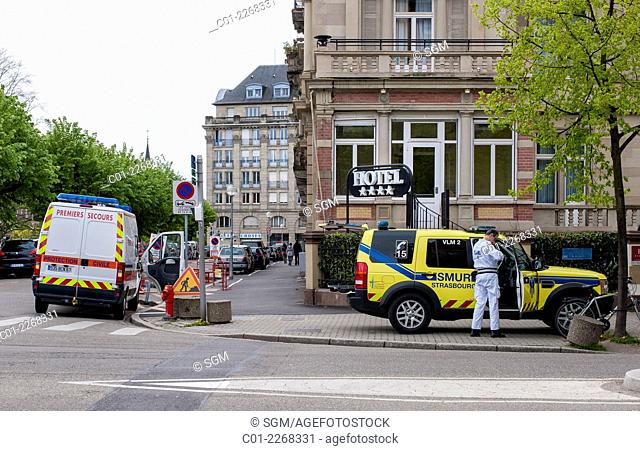 SAMU mobile emergency medical service car and paramedic ambulance in front of hotel Strasbourg Alsace France