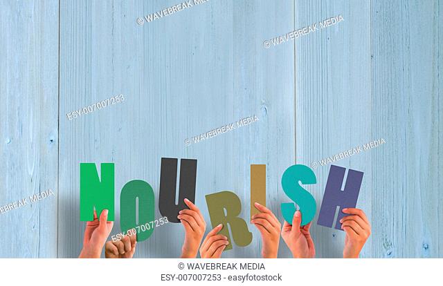 Composite image of hands holding up nourish