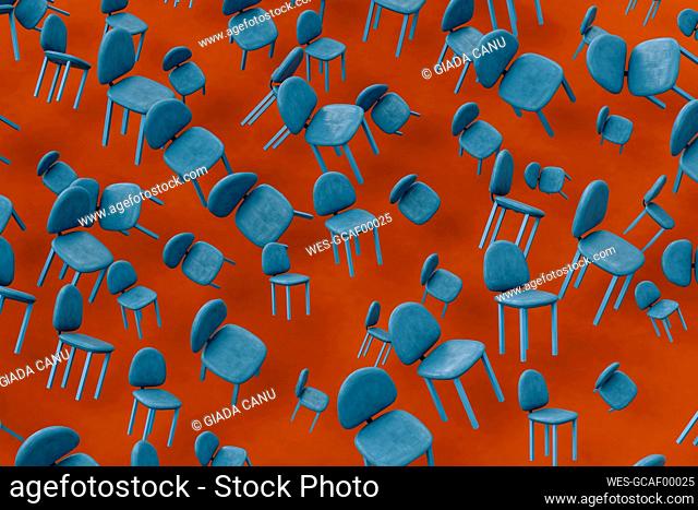 Rows of blue empty chairs floating against red background