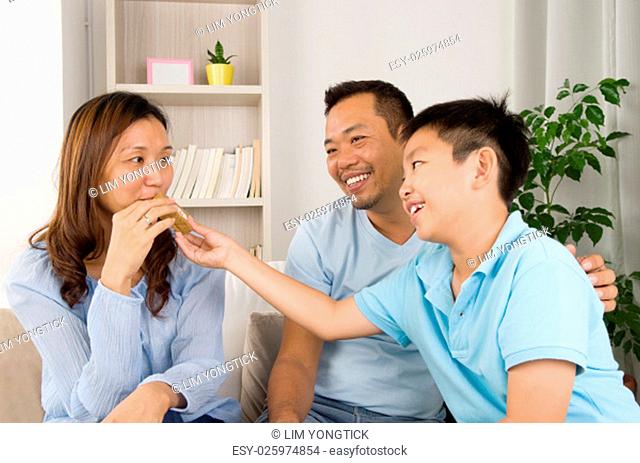 asian family enjoying snack