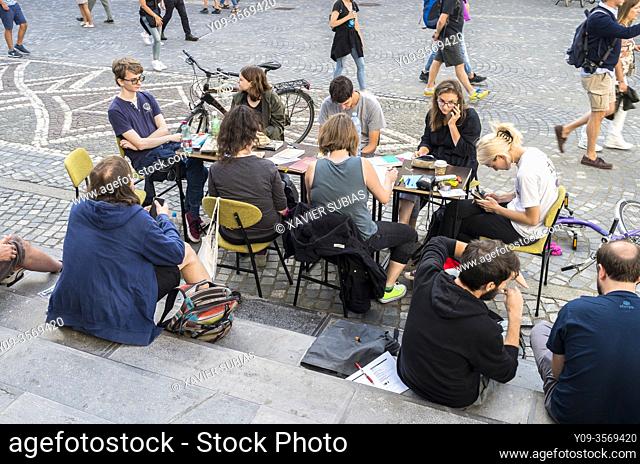 Young people studying on the street, Ljubljana, Slovenia