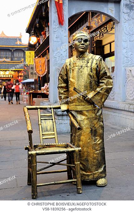 China, Sichuan, Chengdu, Wenshu temple district, Golden human statue featuring a Mandarin