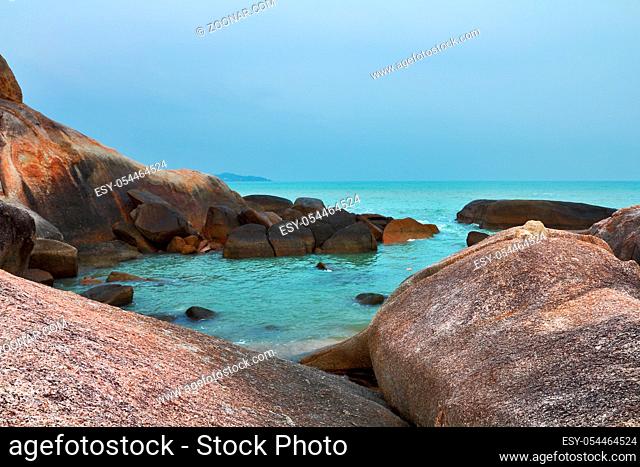 Silent lagoon. A beach and picturesque rocks of island Samuj after flooding and a storm
