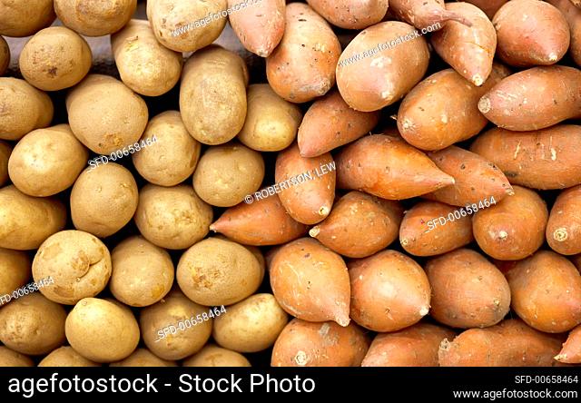 Potatoes and sweet potatoes on a market stall