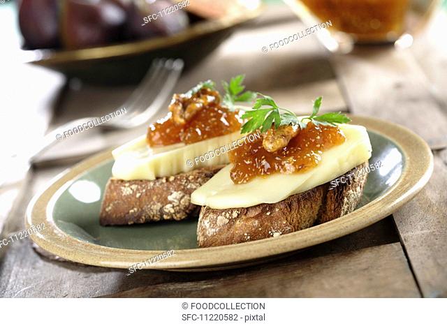 Canape with fig jam, walnuts and cheese