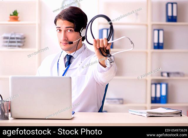Young male doctor in telemedicine concept