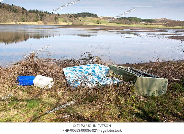 Rubbish dumped at edge of loch, Kilmore, Argyll and Bute, Scotland, april
