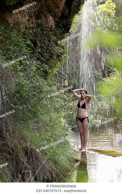 Teenage girl bathing in a lake. Take place in Bogarra, province of Albacete, Spain