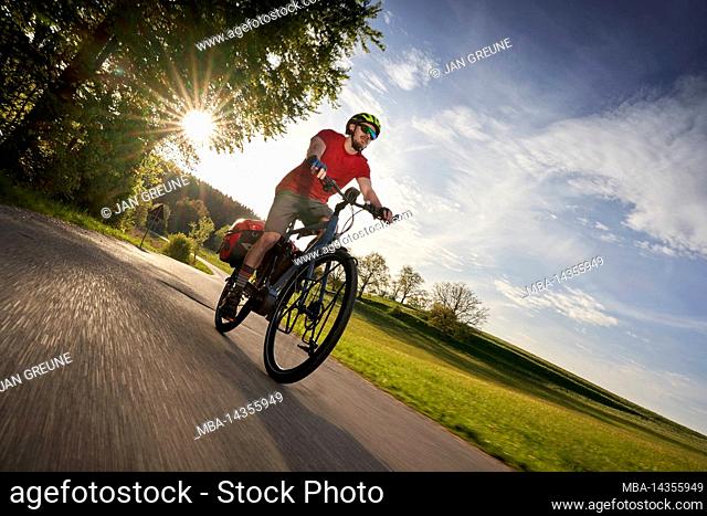 Cyclist on eBike, near Degerndorf, Bavaria Germany