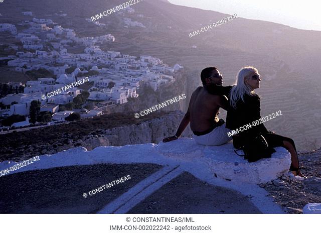 Hill, couple watching sunset  Folegandros, Cyclades, Greece