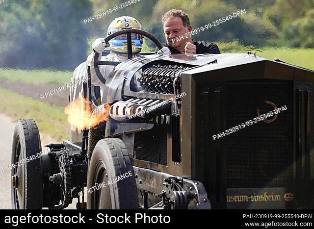 dpatop - 19 September 2023, Baden-Württemberg, Sinsheim: Former racing driver Leopold Prince of Bavaria (l) rides in the ""Brutus"" racing car with an assistant...
