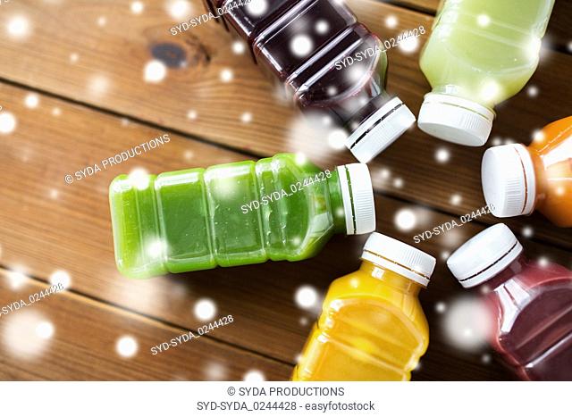 bottles with different fruit or vegetable juices