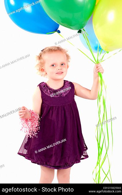 Little cute girl with multicolored air balloons