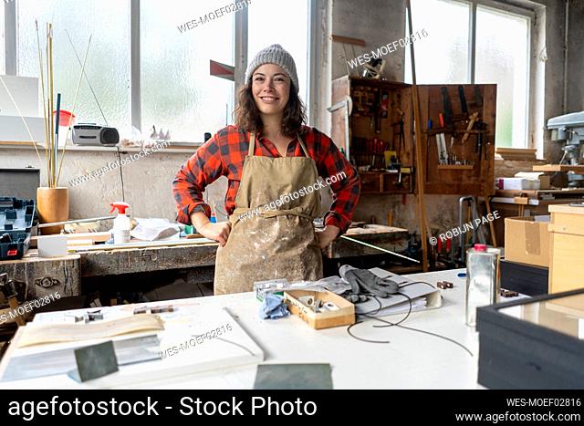 Portrait of confident craftswoman in her workshop