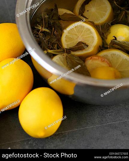 close-up of a pot of boiled lemon, mint and ginger