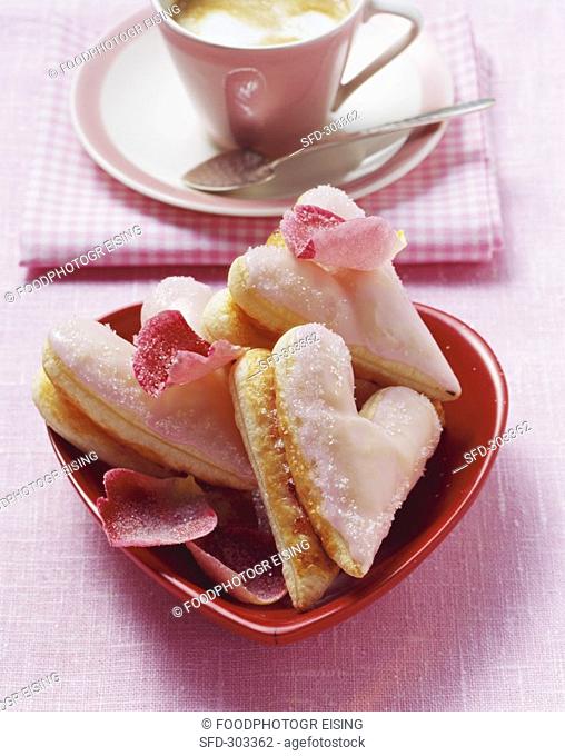 Puff pastry hearts with pink icing