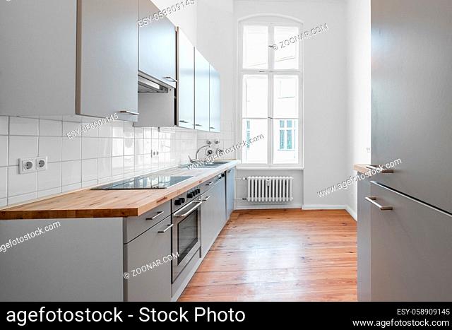kitchen room with fitted kitchen and wooden floor