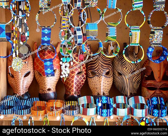 Traditional Kenyan souvenirs - wooden animal masks, beaded bangles. High quality photo