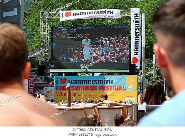 People in Hammersmith, London, follow the screening of the men's single final match between Murray and Djokovic for the Wimbledon Championships at the All...