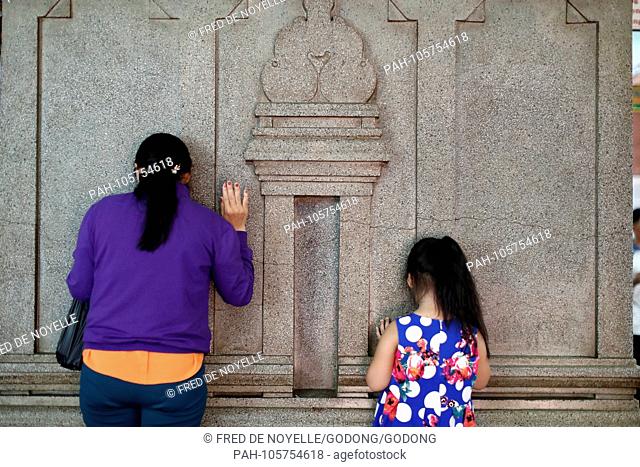 Mariamman Hindu Temple. Worshippers praying on the wall of the sanctuary. Ho Chi Minh city. Vietnam. | usage worldwide. - Ho Chi Minh City/Vietnam