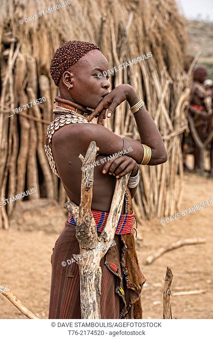 Hamer girl in her village near Turmi in the Omo Valley, Ethiopia