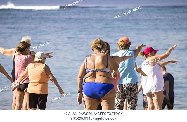 A group of elderly local women at their daily exercise class on Las Canteras beach in Las Palmas, Gran Canaria, Canary Islands, Spain