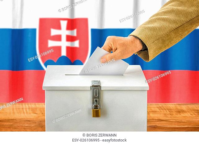 man putting ballot in the ballot box - slovakia