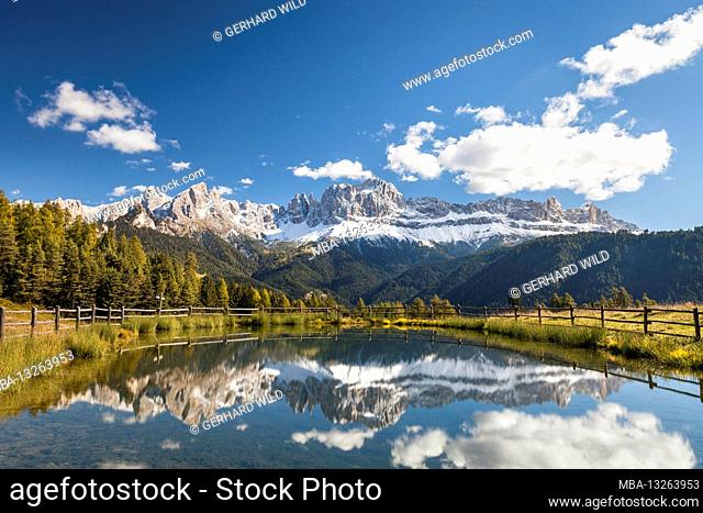 View to the Rosengarten mountains (3004 m), reflection in the mountain lake, UNESCO World Heritage, Dolomites, Trentino-South Tyrol, Italy, Europe