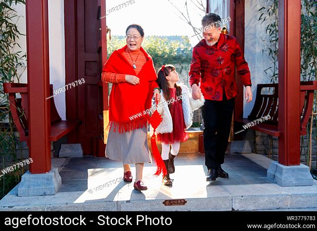 The grandparents and granddaughter to celebrate the New Year of happiness