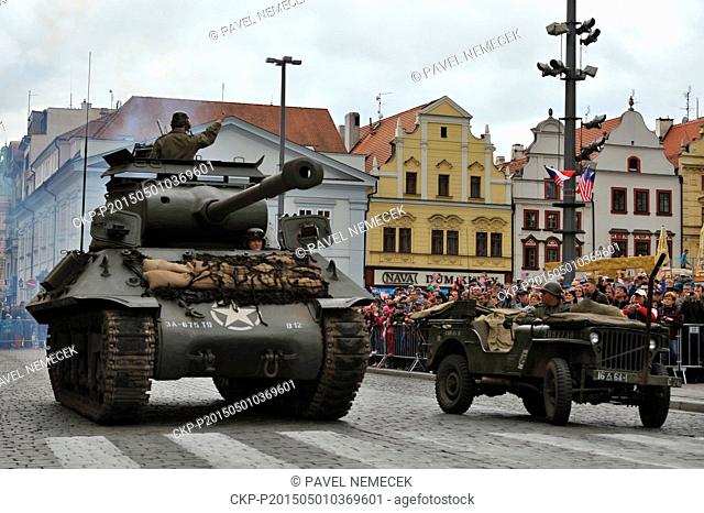 World War II re-enactors dressed as U.S. Army soldiers arrive the Republic's Square on original military cars to mark the 70th anniversary of the liberation...